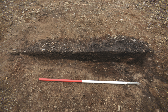 The pear-shaped outline of a kiln for drying grain