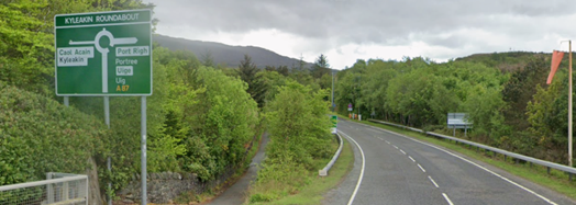 Green primary route direction sign on the northbound A87 at Kyleakin roundabout, including direction to Portree and Uig (with Gaelic versions in white box)